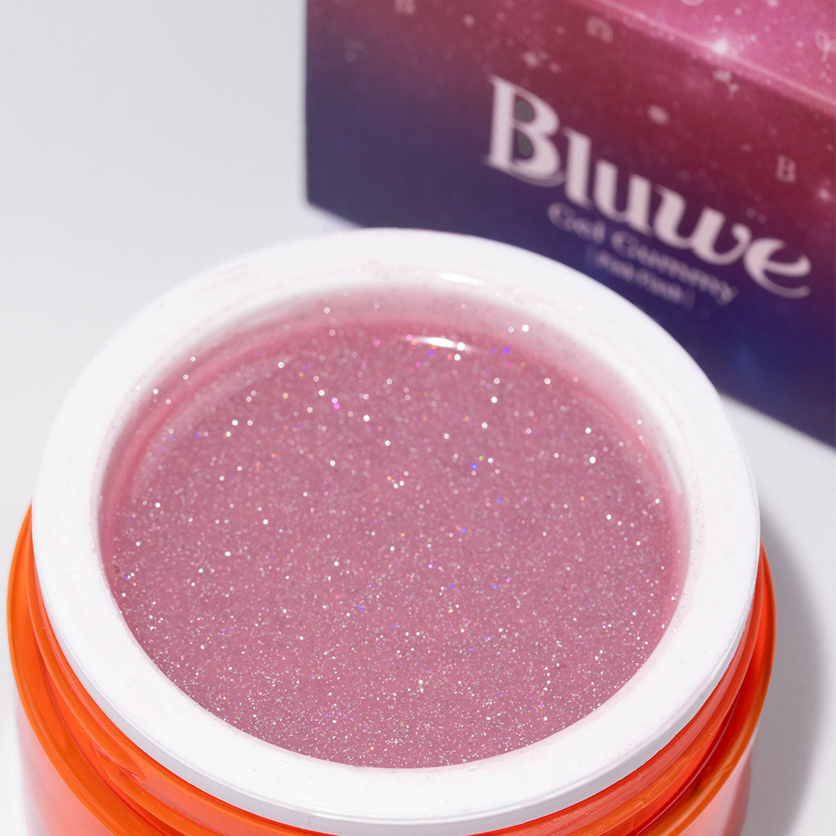 foto em close do pote de gel gummy pink flash. em segundo plano, a caixa do produto