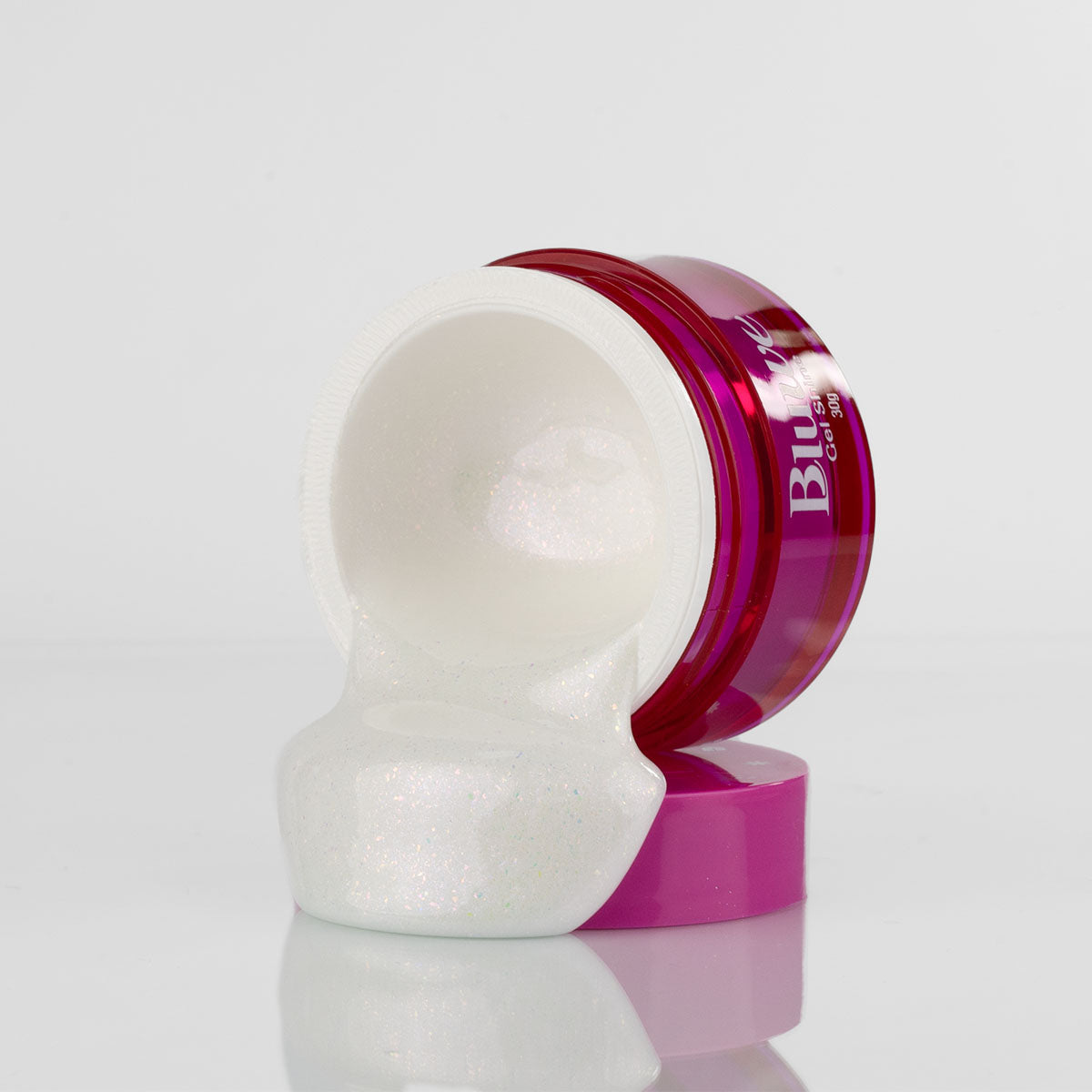 pote do gel shine branquinho, em fundo branco. o pote está virado, dando um efeito de cascata